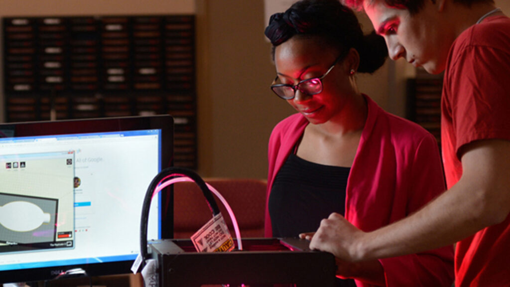 two students using technology